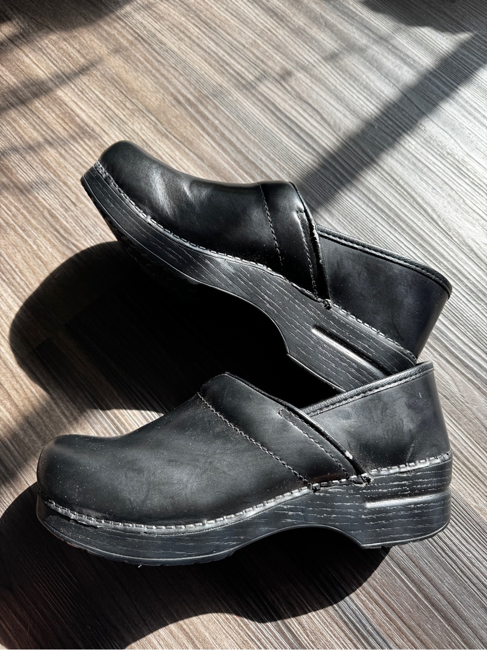 Dansko Black Leather Slip-On Clogs